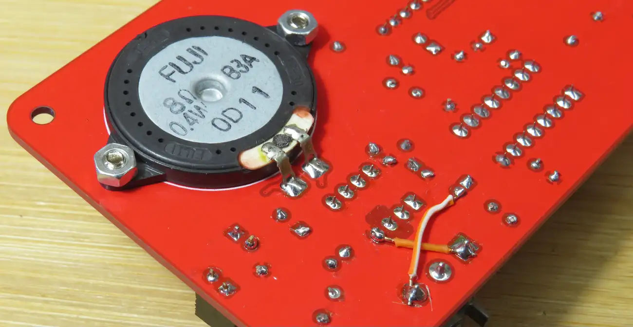 Close-up of the built-in speaker and bodge wires